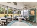 Cozy screened porch with views of the lush green yard, perfect for outdoor relaxation and entertaining at 2327 Ewing Ne Dr, Brookhaven, GA 30319