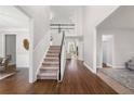 Bright foyer with hardwood floors and a staircase leading to the second floor at 4005 Princeton Trce, Cumming, GA 30041