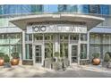 Welcoming entrance to 1010 Midtown, showcasing modern architecture, glass doors and manicured greenery at 1080 Peachtree Ne St # 1812, Atlanta, GA 30309