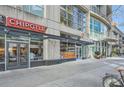 Street-level view of 1010 Midtown, with shops like Chipotle and Piedmont Physicians, offering urban convenience at 1080 Peachtree Ne St # 1812, Atlanta, GA 30309