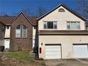 Inviting townhome with a brick accent wall, private entry, and convenient garage parking at 705 Bridge Se Ln, Smyrna, GA 30082
