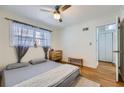 Comfortable bedroom with hardwood floors, a window with curtains, and an open closet at 1284 Piedmont Ne Ave # 12, Atlanta, GA 30309