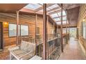 Unique outdoor balcony patio with a trellis roof and wood paneled walls and benches at 1284 Piedmont Ne Ave # 12, Atlanta, GA 30309