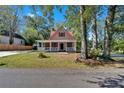 Lovely home showcases a welcoming front porch and lush green lawn at 116 Tallapoosa St, Temple, GA 30179