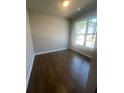 Bright bedroom with hardwood floors and a large window with plenty of natural light at 270 Lakeside Pl, Canton, GA 30114