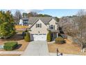 Well-maintained two-story home with a manicured lawn and an attached two-car garage at 3102 Ballet Se Ct, Smyrna, GA 30082