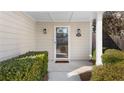 Close-up of the front door with sidelights, decorative lighting and well-maintained landscaping at 3102 Ballet Se Ct, Smyrna, GA 30082