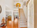 Bright and airy foyer with hardwood floors and a grand staircase leading to the second level at 4397 Challedon Dr, South Fulton, GA 30213