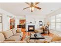 Inviting living room with fireplace, hardwood floors, and open access to the kitchen at 4397 Challedon Dr, South Fulton, GA 30213