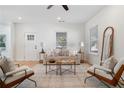 Cozy living room with plush seating, abundant natural light, and hardwood floors at 938 Allene Sw Ave, Atlanta, GA 30310