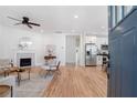 Bright, open-concept space featuring fireplace, wood floors and stainless appliances at 938 Allene Sw Ave, Atlanta, GA 30310