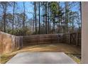 The back yard has a fence and a concrete patio space at 3266 Spicy Cedar Ln, Lithonia, GA 30038