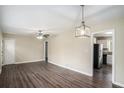 Open-concept living area featuring hardwood floors and updated lighting at 3173 Canary Ct, Decatur, GA 30032