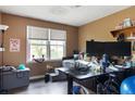 Cozy home office with dual monitors, a window cat perch, and natural light at 378 Cole Sw Dr, Lilburn, GA 30047