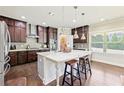Spacious kitchen with granite counters, large island, and stainless steel appliances at 504 Taymack Farm Ct, Woodstock, GA 30188