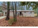 Beautiful one-story brick home featuring a cozy covered carport and a quaint front yard at 1883 Windsor Sw Dr, Atlanta, GA 30311