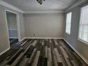 Spacious dining room featuring modern flooring, neutral paint, and natural light at 745 Queen Ann Ct, Stone Mountain, GA 30083