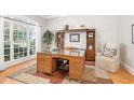 Elegant home office with a large window, hardwood floors, and built-in shelving at 1967 Mason Mill Rd, Decatur, GA 30033