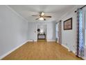 Bright living room featuring pristine wood floors and stylish decorative curtains at 567 Shiloh Nw Rd, Kennesaw, GA 30144
