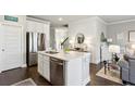 Modern kitchen showcasing a center island, stainless steel appliances, and ample cabinet space at 355 Cherryhill Ln, Woodstock, GA 30188