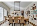 Elegant dining room with hardwood floors and a farmhouse style table and chairs at 3820 N Berkeley Lake Nw Rd, Berkeley Lake, GA 30096