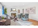 Cozy living room featuring a fireplace, plush seating, and natural light at 1403 Centra Villa Dr, Atlanta, GA 30311