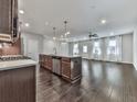 Spacious kitchen with center island, modern appliances, and an open layout flowing into the living area at 1020 Broadview Dr, Marietta, GA 30062