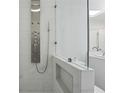 Modern bathroom shower with sleek fixtures, glass door, and tiled walls at 3636 Peachtree Ne Rd # 405, Atlanta, GA 30319