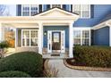 Inviting front entrance with decorative door, sidelights, and manicured landscaping at 6158 Brookmere Pl, Mableton, GA 30126