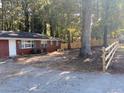 View of a portion of the home showing landscaping and new backyard fencing at 687 N Hairston Rd, Stone Mountain, GA 30083