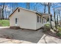 Single-story home's rear entrance and driveway at 881 Brighton Dr, Lawrenceville, GA 30043