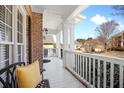 Relaxing covered porch with white columns and neighborhood views at 1102 White Cloud Rdg, Snellville, GA 30078