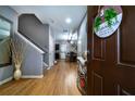 Inviting entryway with wood floors, staircase, and stylish decor at 2376 Allman Dr, Jonesboro, GA 30236