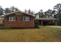 Cozy brick home with a covered carport and a neatly landscaped front yard at 2630 Colonial Dr, College Park, GA 30337