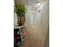 Upstairs hallway with neutral carpet, white doors, and ample storage space at 3032 Cedar Glade Ln, Buford, GA 30519