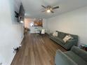 Comfortable living room with modern furniture, hardwood floors, and an open-concept layout at 3032 Cedar Glade Ln, Buford, GA 30519