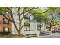 Attractive building exterior with balconies, brick accents, and mature trees at 3071 Lenox Ne Rd # 11, Atlanta, GA 30324