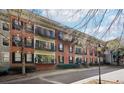 Brick building featuring balconies, and lush green landscaping at 3071 Lenox Ne Rd # 11, Atlanta, GA 30324