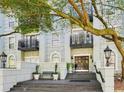 Elegant building facade with stately entrance, stone steps, and manicured landscaping at 3071 Lenox Ne Rd # 11, Atlanta, GA 30324