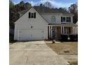 Traditional two-story home with a two-car garage and covered front entry at 2162 Fall Creek Ldg, Loganville, GA 30052