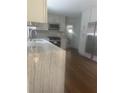 Bright kitchen featuring granite countertops, stainless steel appliances, and hardwood floors at 1759 Wilmont Ne Dr, Atlanta, GA 30329