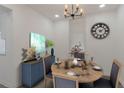 Cozy dining room with stylish furnishings and decor, featuring a wood table set for dinner at 235 Dodd Sw Ave, Atlanta, GA 30315