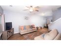 Inviting living room with contemporary decor, cozy seating, and a ceiling fan at 2763 Snapfinger Mnr, Decatur, GA 30035