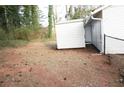 Backyard area features a storage shed for organizing outdoor items and equipment at 5928 Seam St, Lithonia, GA 30058