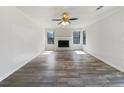 Open living room featuring a fireplace and wood floors at 901 Chapman Cir, Stone Mountain, GA 30088