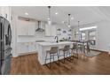 Modern kitchen featuring a center island, stainless steel appliances, and an adjacent breakfast area at 12 Ridgeline Nw Way, Cartersville, GA 30121