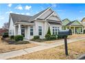 Inviting single-story home showcasing a well-kept lawn, a mailbox, and beautiful landscaping at 330 Abbey Ct, Canton, GA 30115