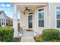 Cozy front porch with a ceiling fan and charming details creating a welcoming entrance at 330 Abbey Ct, Canton, GA 30115