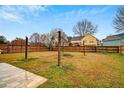 Spacious backyard with a wooden fence, mature trees, and potential for outdoor activities and landscaping at 3925 Keystone Nw Rdg, Acworth, GA 30101