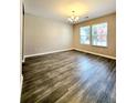 Bright living room featuring stylish gray plank flooring and sunlit windows for a welcoming space at 2533 Piering Dr, Lithonia, GA 30038